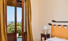 Villa Le Poiane | Bedroom 4 with double sized bed and terrace access Bedroom 4 with double sized bed and terrace access