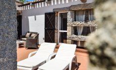 Private terrace of Casa 24 with sunbeds and sofa, Sant Elmo