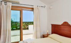 Villa del Campo | Bedroom 1 on the first floor with a double sized bed and terrace access Bedroom first floor with a double sized bed and terrace access