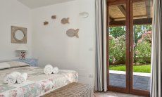 Villa Campidano 8 | Bright bedroom 1 with an outdoor view Bedroom and garden