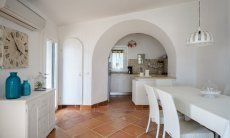 Li Conchi 27 | Dining area with kitchen in the background Dining area with kitchen in the background