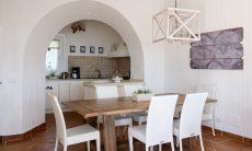 Dining area inside with a kitchen view