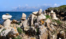 Rocks and the isle of Tavolara in the background