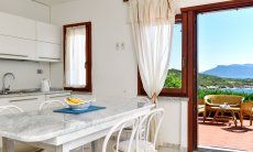 Dining table inside with sea view 