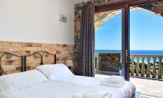 Apartment Castededdu 1 | Bedroom 1 with with terrace access and sea view Bedroom 1 with with terrace access and sea view