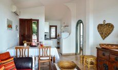 Apartment Castededdu 1 | Living room with sofa corner, dining table and kitchen Living room with sofa corner, dining table and kitchen