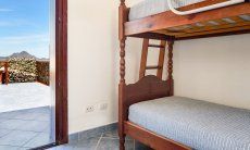 Apartment Castededdu 5 | Bedroom 2 with bunk bed and terrace access Bedroom 2 with bunk bed and terrace access
