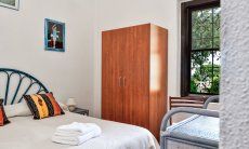 Villa Alessia | Bedroom 1 with garden window Bedroom 1 with garden window