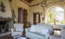 Villa Is Molas Monte | Lounge area in the living room with big panoramic window towards the garde and the valley 2018 New Picture