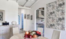 Dining area with view to the kitchen and bedrooms