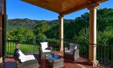 Terrace west wing with lounge furniture and a view towards the garden 