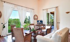 Living room with a sofa corner and a stunning view over the garden 