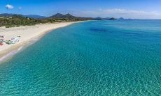 Arial view of the beach and crystal clear water of Cala Sinzias, only about 1.5 miles from Li Conchi