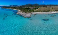 Airview of Sant Elmo with its crystal clear sea, looking south