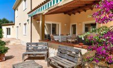 Villa Caroline | Big and roofed terrace with dining table Big and roofed terrace with dining table