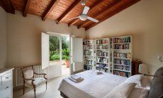 Villa Caroline | Bedroom 1 with double sized bed and view across the garden Bedroom 1 with double sized bed and view across the garden