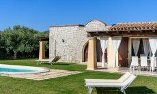 Villa Campidano 20 | Garden with green lawn, pool and house Villa Campidano 20 with garden and pool