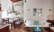 Villa Vela | Living area with sofa corner and dining table Living area with sofa corner and dining table