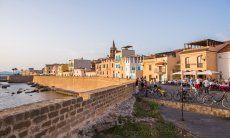 Alghero's city wall and the first row of houses directly above the sea