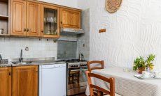 Casa Meloni 1 | Kitchen with all essential devices and breakfast table Kitchen with all essential devices and breakfast bar