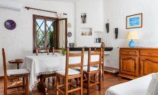Casa Meloni 2 | Dining table in the living area Living room with dining area Meloni 2 in Sant Elmo