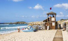 Sandy and white beach of Chia, 20 km. far away