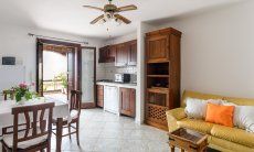 Apartment Castededdu 3 | Living area with kitchen, dining table and kitchen Living area with kitchen, dining table and kitchen
