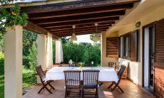 Roofed terrace with dining table 