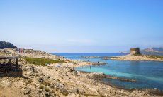 View from the coast onto the spanish tower of La Pelosa, Stintino