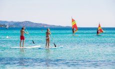 Stand-up paddle and Windsurf in the bay of La Cinta, San Teodoro, Olbia