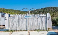 Showers on the beach of Golfo Aranci