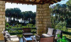 Villa Pola | Lounge area on the terrace with view on the sea through pine trees Lounge area on the terrace with view on the sea through pine trees