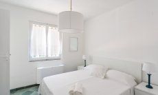 Villa Pola | Bedroom 5 with double bed and window onto the garden Bedroom 5 with double bed and window onto the garden