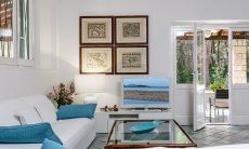 Villa Pola | Elegant sofa corner with TV and door to the terrace and garden Elegant sofa corner with TV and door to the terrace and garden