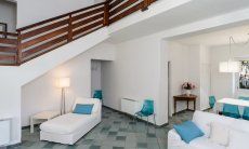 Villa Pola | Chaise longue and staircase to the first floor Chaise longue and staircase to the first floor