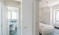 Villa Pola | Bedroom 2 and view into the extra bath with toilet Bedroom 2 and view into the extra bath with toilet