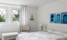 Li Conchi 30 | Bedroom 3 with double bed in the basement floor with window towards the garden Presentation of Li Conchi 30