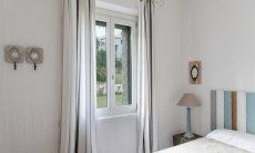 Li Conchi 30 | Badroom 2 with two single beds and window with garden view Presentation of Li Conchi 30