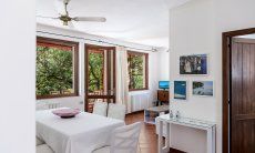 Casa Su Faru 2 | Living room with bright colours and a lot of daylight thanks to the big windows Living room Su Faru 2 Pula