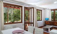 Casa Su Faru 2 | Big window with view into the green bushes from the living room Big window with view into the green bushes from the living room of Su Faru 2 Pula