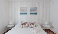 Casa Su Faru 3 | Bedroom 1 with double bed furnished in light, white colours Double room Su Faru 3 Pula