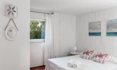 Casa Su Faru 3 | Bedroom 1 with double bed and window to the garden Bedroom with double bed and window to the garden of Su Faru 3 Pula