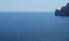 Boat on the sea and the cliff rock Pan di Zucchero