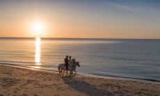 Horsebackriding at sunrise on the beach of Rei Sole, Costa Rei
