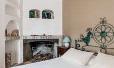 Apartment Orri 3 | Bedroom 2 on the second floor with double bed and fire place App. Orri 3 Tortoli Eastcoast Sardinia
