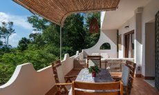 Apartment Orri 3 | Terrace with table to eat outside and roof to give shade App. Orri 3 Tortoli Eastcoast Sardinia