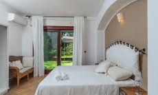 Apartment Orri 1 | Bedroom 1 with double bed and direct access to the garden Orri 1 Tortoli, East Sardinia