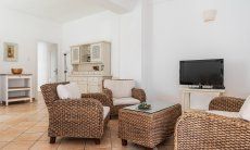 Apartment Orri 2 | Spacious living room with wickered sofa and TV App. Orri 2, Tortoli, Eascoast Sardinia