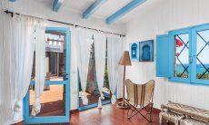 Casa 17 | Living room with windows to the terrace and the sea Casa 17, Sant Elmo, South Sardinia