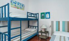 Casa 17 | Bedroom 2 with bunk bed and one single bed Casa 17, Sant Elmo, South Sardinia